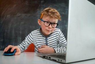 Little,Kid,Boy,Programming,With,Laptop,Computer.,Close,Up,Of