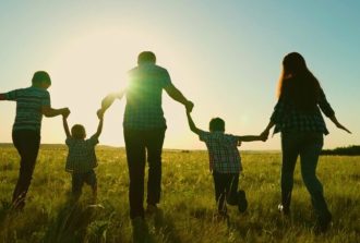 Happy,Family,,Parents,,Children,Run,In,The,Park.,The,Concept